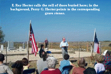 E. Roy Hector calls the roll of those buried here; in the background, Perry G Hector points to the corresponding grave stones. E. Roy Hector calls the roll of those buried here; in the background, Perry G Hector points to the corresponding grave stones.