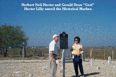 Herbert Neil Hector and Gerald Dean "Geri" Hector Lilly unveil the Historical Marker.